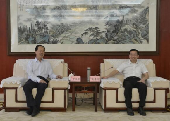 丁焰章拜會南昌市委副書記、市長黃喜忠